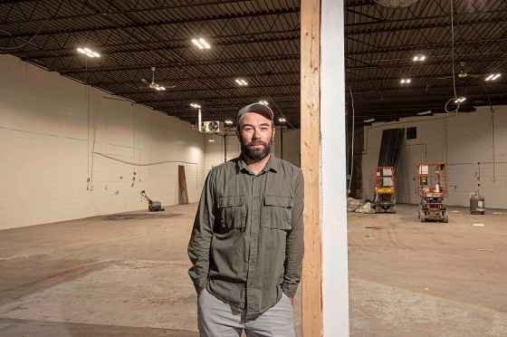 Low Life Barrel House co-founder Tyler Birch stands in the future home of Low Life Barrel House. The space has been gutted and construction has begun in the Daly St. N. building that previously housed Electra Sign. (Mike Sudoma / Winnipeg Free Press)