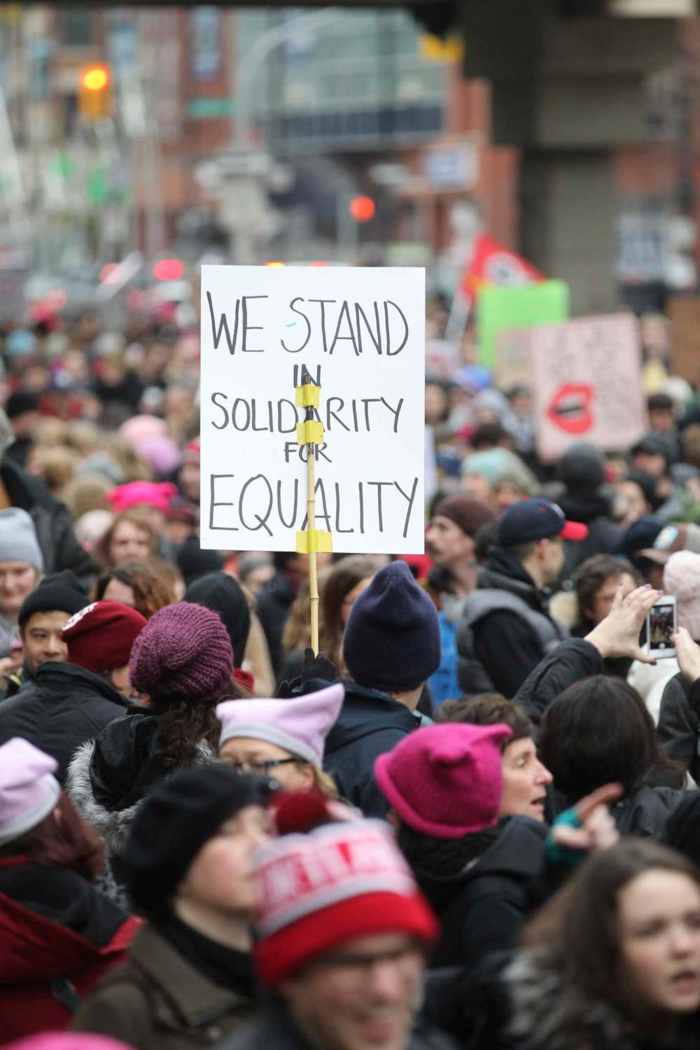 Homemade signs were the order of the day as hundreds of marchers make their way down Portage Ave. Saturday during the Women's Day March.