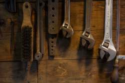 Tools hang on the wall of the forge.