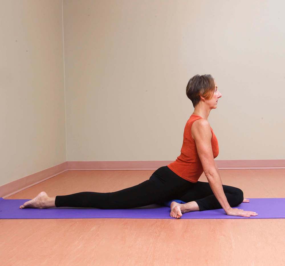 SWAN
Begin on all fours in a table-top position. Slide your left knee between your hands, positioning your left heel under your right hip. Stretch your right leg straight back. Keeping your hips level, lower your left hip onto your support unless it reaches the floor without losing the levelness in your hips. Hold for three to five minutes. Repeat with the right leg forward.