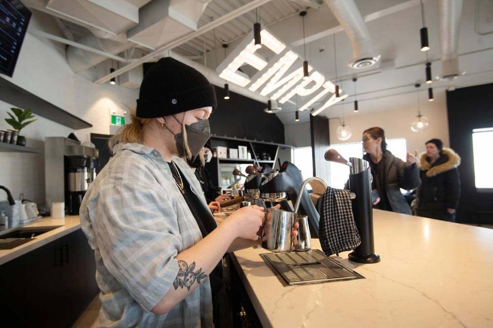 Barista Emily Green steams milk while making a vanilla latte at Empty Cup on Academy Road. (Mike Sudoma / Winnipeg Free Press)