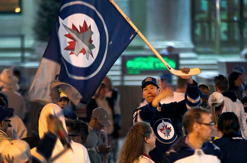 Winnipeg Jets fans take over the intersection of Portage Avenue and Main street after a 5-0 victory over the Minnesota Wild, the team