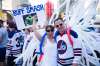 MIKAELA MACKENZIE / WINNIPEG FREE PRESS
Sandy Qwong, left and Daniel Muller cheer on Donald Street at the Whiteout street party.