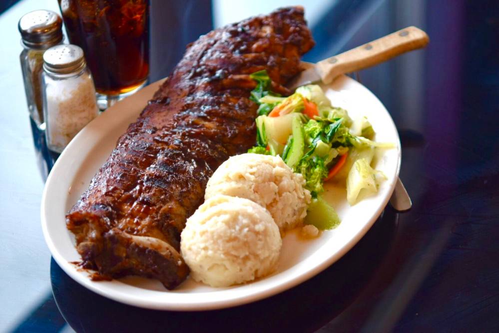 Paint Lake Lodge near Thompson offers an expansive deck that over that deep, dark lake and invites one and all to share the day’s adventures with their signature rib dinner.