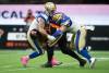DARRLY DYCK / THE CANADIAN PRESS FILES
Blue Bombers defensive tackles Casey Sayles (left) and Adam Bighill take down B.C. Lions QB Michael Reilly last season in Vancouver. After bouncing around between the NFL, AAF and XFL, Sayles has finally found some stability in Winnipeg.