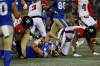 Winnipeg Blue Bombers quarterback Zach Collaros gets drilled by Ottawa Redblacks' Randall Evans (right) in the fourth quarter. Collaros had to leave the game as per concussion protocol. (John Woods / The Canadian Press files)