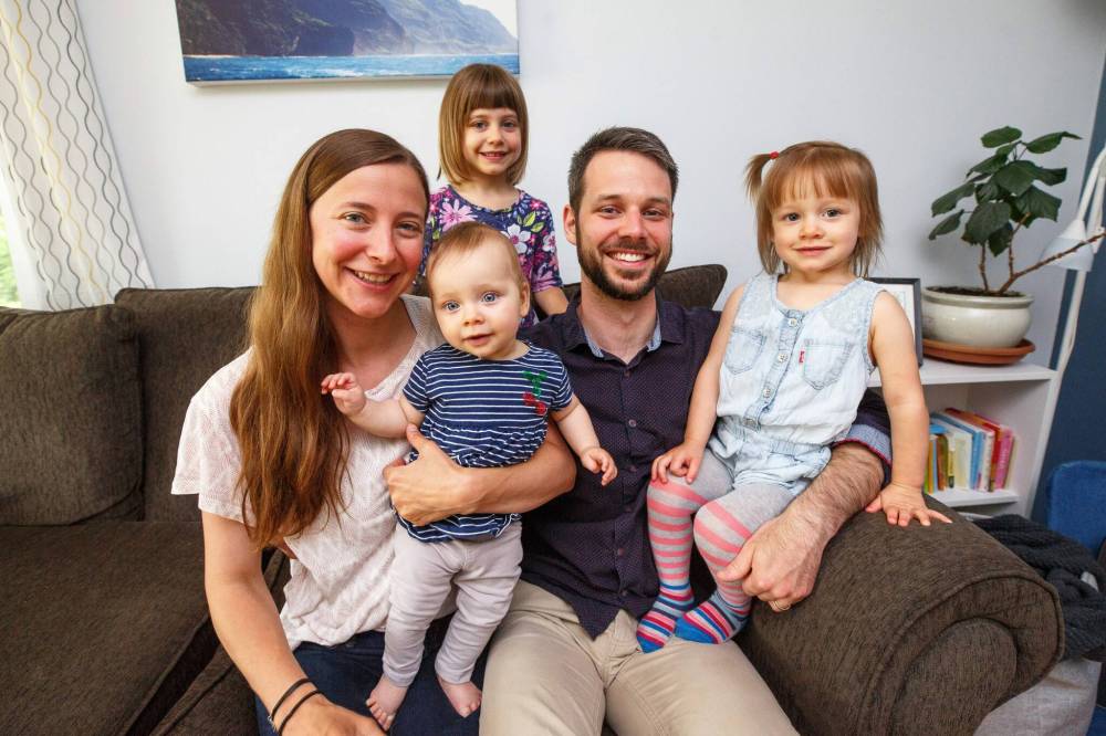 MIKE DEAL / WINNIPEG FREE PRESS
Janelle and Eric Vielfaure and their three daughters, Milanne, 4, Charlotte, 2, and Raphaelle, 9 months, are back in the pews at their home parish of St. Boniface Cathedral.
