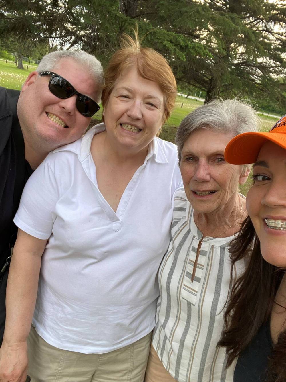 Kevin Lloyd, Sharon Lloyd, Rae Avison, and Shelley Cook pose for a selfie at St. Clements Cemetery in Selkirk