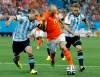 Victor R. Caivano / The Associated Press files
Arjen Robben (centre) of the Netherlands takes on a pair Argentinian players during the 2014 World Cup in Brazil