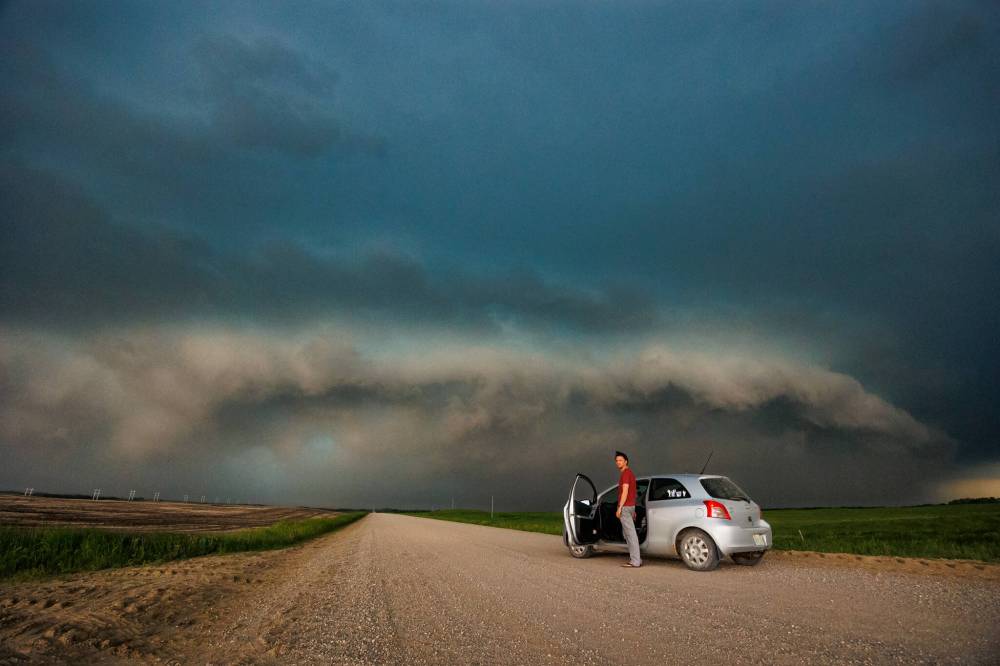 CHRIS GRAHAM PHOTO
Regina-based storm spotter Nick Schenher prepares to photograph severe weather near Moosomin, Sask.