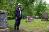ETHAN CAIRNS / WINNIPEG FREE PRESS
Gary Van Den Bossche stands in a puddle of standing water in front of his parents' headstone at Brookside Cemetery on Tuesday.