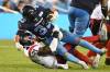Toronto Argonauts running back Andrew Harris is tackled by Montreal Alouettes linebacker Chris Ackie during CFL football action in Toronto Thursday. THE CANADIAN PRESS/Jon Blacker