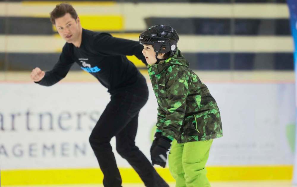 Vlady Taran shows off some of his figure skating skills to a Disney On Ice performer.