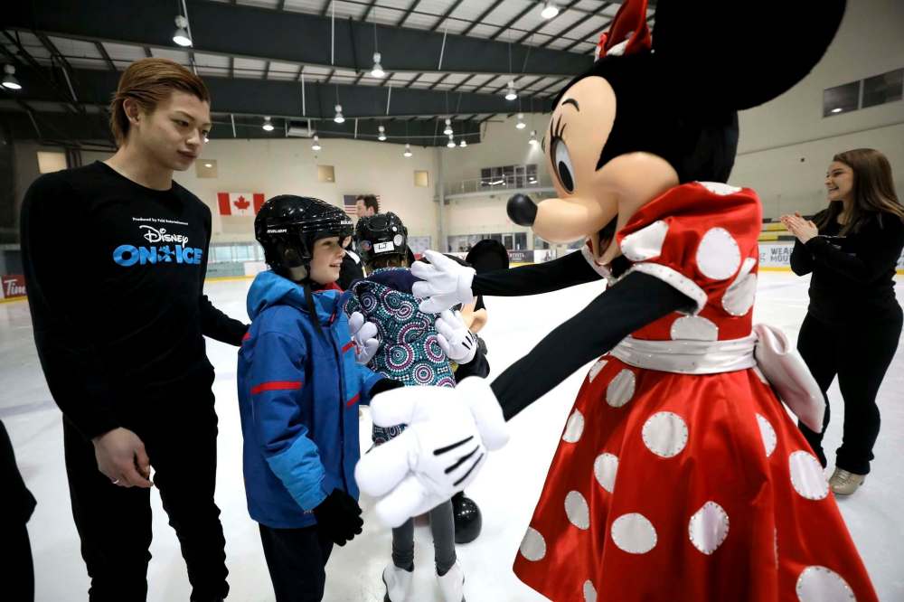 Minnie offers Timothy Jolicoeur a hug.