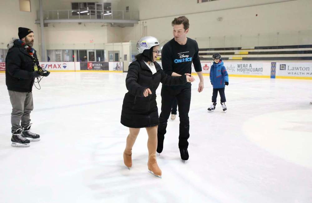 Ruth Joseph skates with a performer.