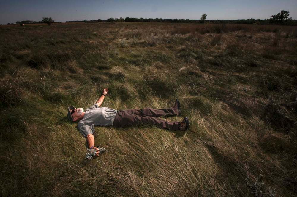 SEPTEMBER 2013: Roseisle artist Stephen Jackson soaks up the lush landscape at the Souris Ford Mounds, a National Historic site in the far south west corner of Manitoba.