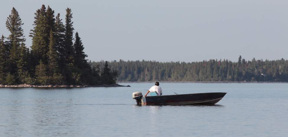 JOE.BRYKSA@FREEPRESS.MB.CA
A First Nation fisherman on Island Lake, which used to be pure enough for drinking before the area's semi-nomadic people settled into communities.