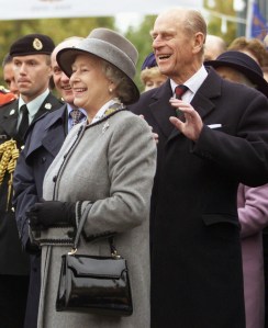 CPQueen Elizabeth II and Prince Philip react as they watch a demonstration during ceremonies in Winnipeg on Oct. 8, 2002. (Adrian Wyld / The Canadian Press files)
