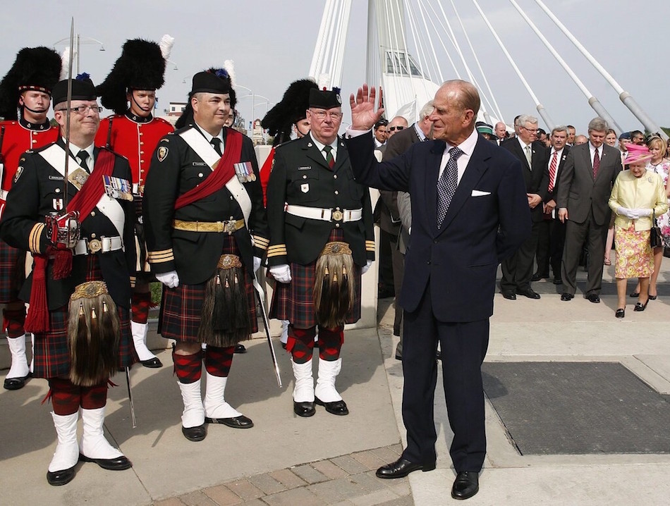 CP
Prince Philip greets a contingent of The Queen's Own Cameron Highlanders as Queen Elizabeth II is escorted by prime minister Stephen Harper on the Esplanade Riel during a visit in Winnipeg on July 3, 2010.  (John Woods / The Canadian Press files)