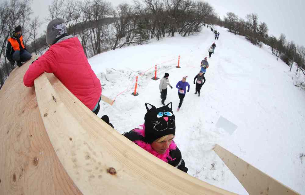 TREVOR HAGAN / WINNIPEG FREE PRESS
Participants make their way over the Tower of Power obstacle during the Ice Donkey event.