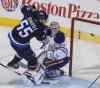 MIKE DEAL / WINNIPEG FREE PRESS
Winnipeg Jets Mark Scheifele (55) falls over Edmonton Oilers' goaltender Ben Scrivens (30) during NHL action in Winnipeg Wednesday at the MTS Centre.