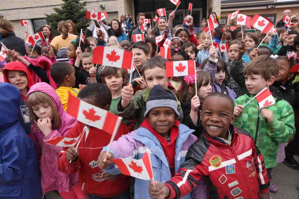 JOE BRYKSA / WINNIPEG FREE PRESS
Kids from École Précieux-Sang wait to get a glimpse of His Royal Highness Prince Charles at Place Bernadette Poirer, before he officially opened the supportive housing project for people with mental health issues.