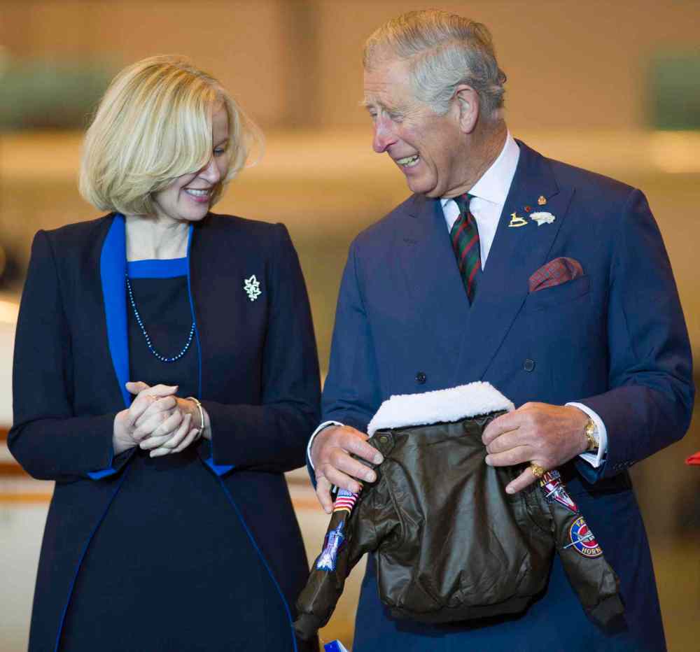 David Lipnowski / The Canadian Press
Laureen Harper looks on as Prince Charles accepts a flight jacket as a gift for his grandson, Prince George, at the Stevenson Hangar at Red River College. The Royal couple met with students at an Aerospace and Aviation in Manitoba Day event.