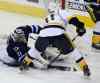 Trevor Hagan / The Canadian Press
Winnipeg Jets' goaltender Ondrej Pavelec (31) stops Nashville Predators' David Legwand (11) right in front of the net during first period in Winnipeg Tuesday.