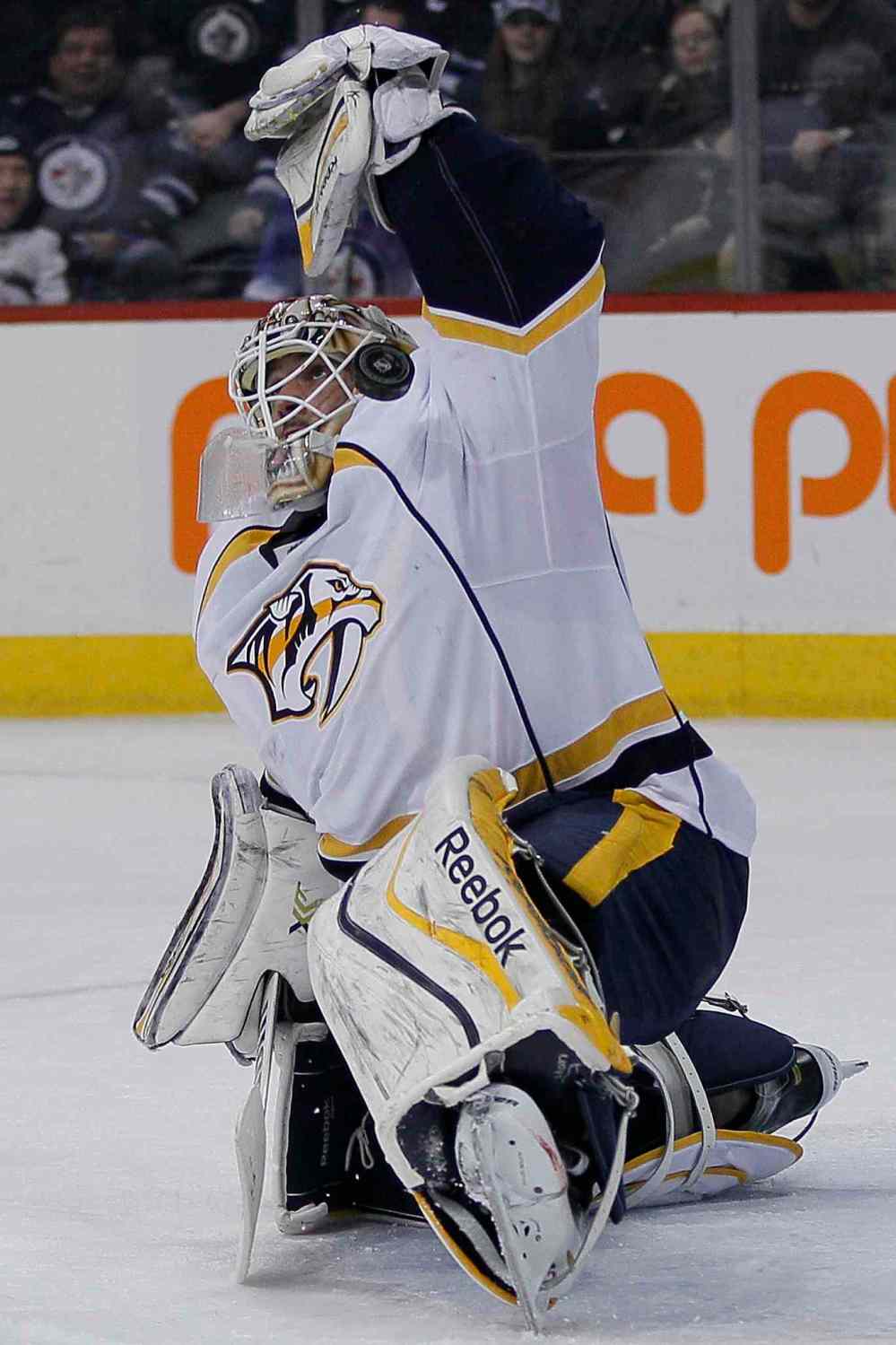 John Woods / Winnipeg Free Press
Nashville Predators' goaltender Carter Hutton (30) saves Winnipeg Jets' Blake Wheeler's (26) shot but the puck goes off his leg and into the goal — the Jets' third during second period in Winnipeg on Tuesday.