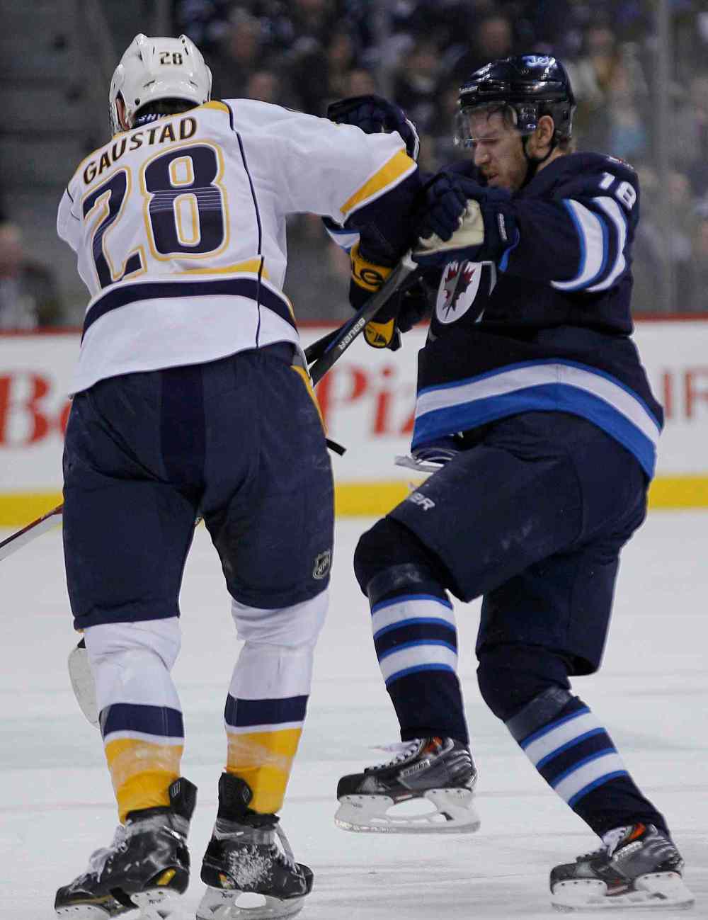John Woods / Winnipeg Free Press
Winnipeg Jets' Bryan Little (18) gets checked by Nashville Predators' Paul Gaustad (28) during second period NHL action in Winnipeg.