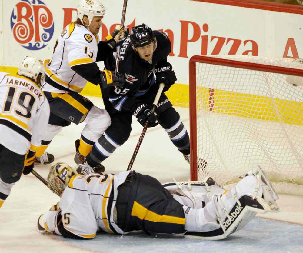 JOE BRYKSA / WINNIPEG FREE PRESS
Winnipeg Jets' Mark Scheifele missed a great chance to get by Nashville Predators goaltender Pekka Rene as he's pushed by Olli Jokinen during the third period of Friday's game. The Predators won 2-0.