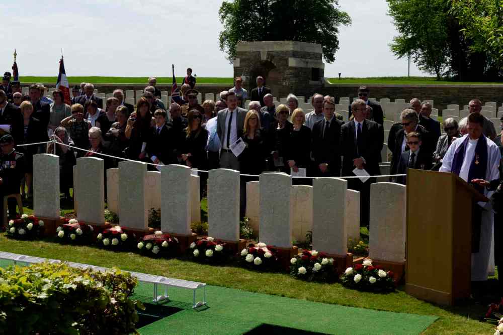 Corporal Jordan Lobb, Canadian Forces Joint Imagery Center, Ottawa
Flowers are laid at the headstones of eight Canadian First World War soldiers from the 78th Battalion at the Caix British Cemetery in Caix, France on 13 May 2015 as part of the largest single find of unknown Canadian soldiers since the Canadian Armed Forces Casualty Identification program started in 2006.