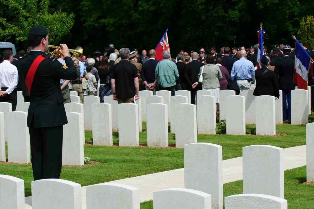 Corporal Jordan Lobb, Canadian Forces Joint Imagery Center, Ottawa
Sergeant Marc-Andre Lachapelle, the bugler from the Royal 22e Regiment, plays the Last Post during the burial of eight Canadian First World War soldiers from the 78th Battalion at the Caix British Cemetery in Caix, France on 13 May 2015 as part of the largest single find of unknown Canadian soldiers since the Canadian Armed Forces Casualty Identification program started in 2006.