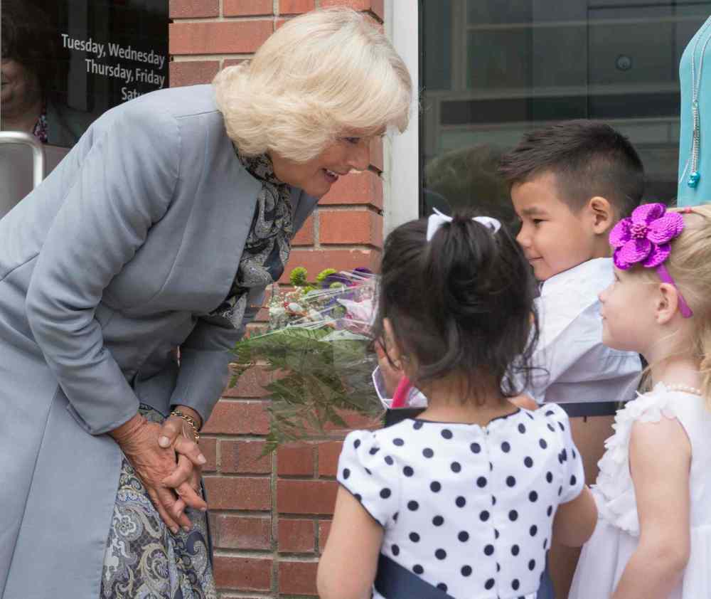 David Lipnowski / THE CANADIAN PRESS
Camilla, the Duchess of Cornwall, receives flowers from children outside of the Assiniboine Credit Union following a visit to learn about the institution in Winnipeg Wednesday.