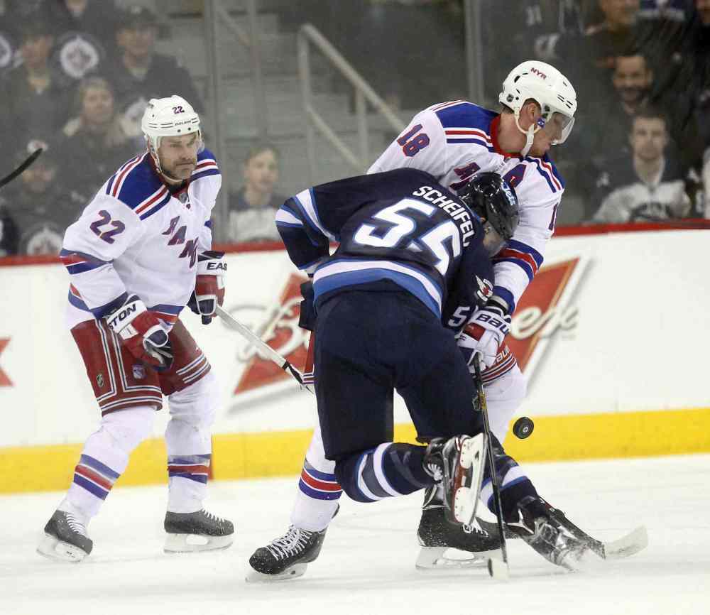 Phil Hossack / Winnipeg Free Press
Winnipeg Jets Mark Scheifele collides with New York Rangers Marc Staal as Dan Boyle watches in the first period.