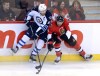 Sean Kilpatrick / The Canadian Press
Ottawa Senators' Cody Ceci, right, and Winnipeg Jets' Adrew Ladd fight for the puck during first period NHL hockey action in Ottawa Thursday.