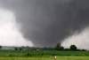 Paul Hellstern / The Associated Press
A tornado passes across south Oklahoma City, Monday. A monstrous tornado roared through the Oklahoma City suburbs, flattening entire neighborhoods with winds up to 320 km/h, setting buildings on fire and landing a direct blow on an elementary school.