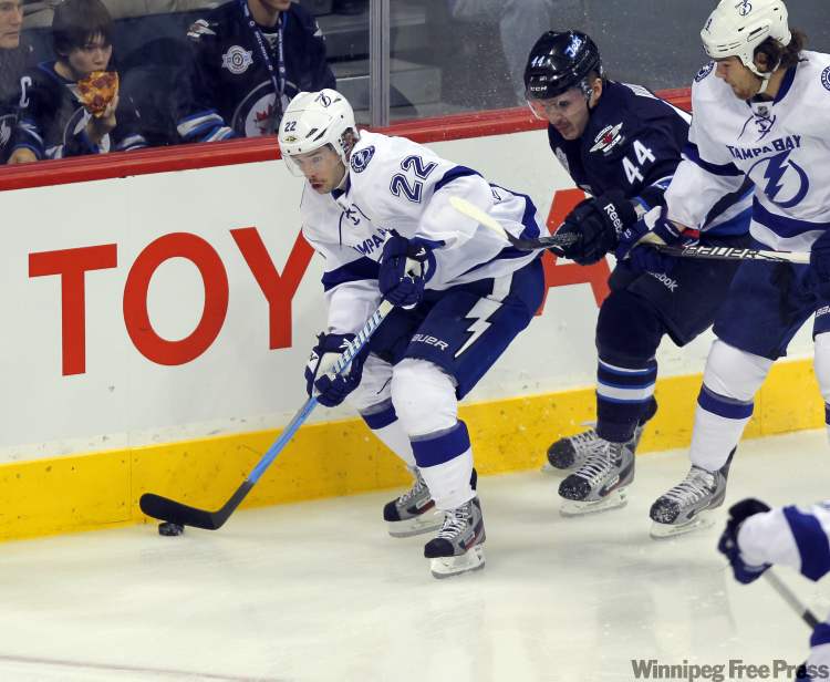 Winnipeg Free Press
Ryan Shannon of the Tampa Bay Lightning moves the puck along the boards against the Winnipeg Jets during first-period action at the MTS Centre Monday.