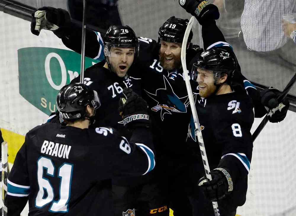 Marcio Jose Sanchez / The Associated Press
San Jose Sharks' Joe Pavelski (8) celebrates his goal with teammates during the third period of an NHL hockey game against the Winnipeg Jets on Thursday. San Jose won 1-0.