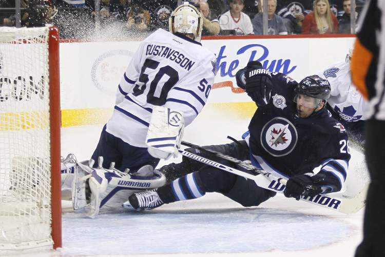 John Woods / Winnipeg Free Press
Winnipeg Jets' Blake Wheeler crashes into Toronto Maple Leafs' goaltender Jonas Gustavsson during second-period action Tuesday.