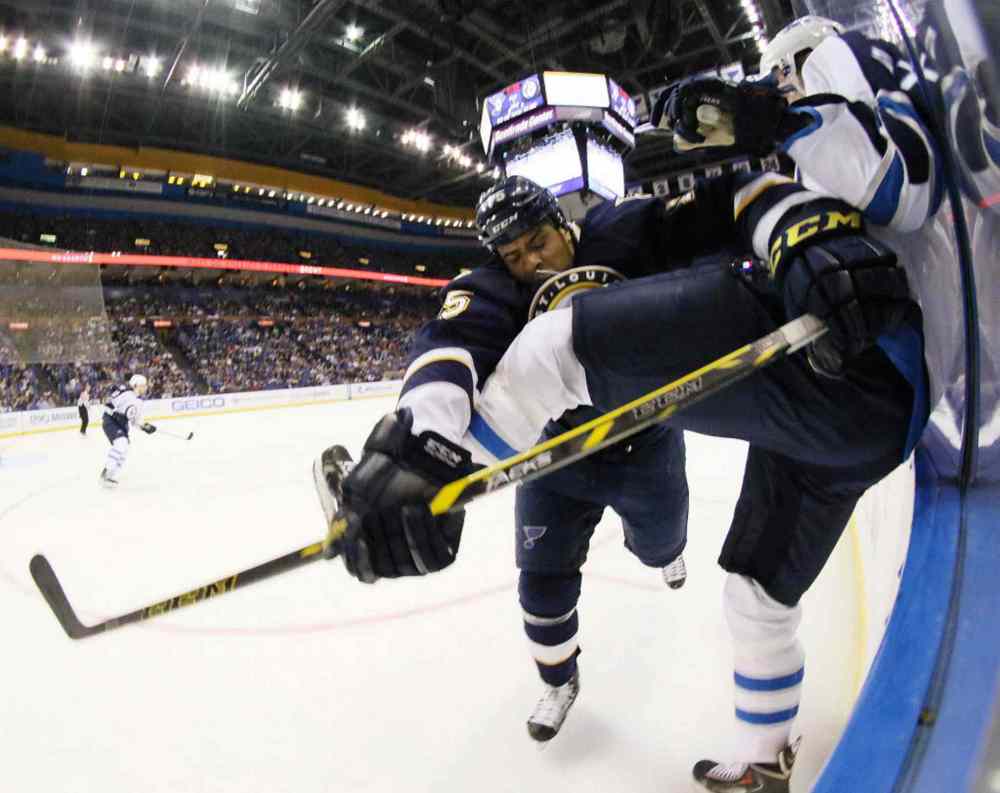 Chris Lee / Tribune Media TNS
The St. Louis Blues' Ryan Reaves collides with the Winnipeg Jets' Tyler Myers, right, in the first period.