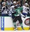 Michael Ainsworth / Dallas Morning News / TNS
The Dallas Stars' Curtis McKenzie (11) shoves the Winnipeg Jets' Mark Scheifele (55) into the bench during the first period at American Airlines Center in Dallas on Tuesday.