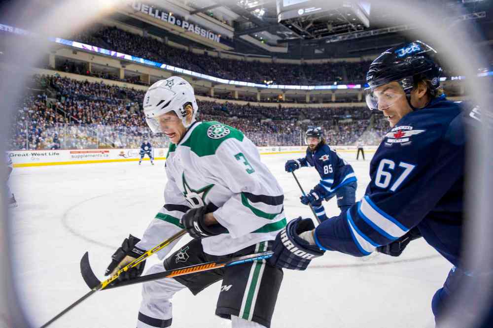 David Lipnowski / Winnipeg Free Press
Winnipeg Jets Michael Frolik (#67) collides with Dallas Stars John Klingberg (#3) during second period.