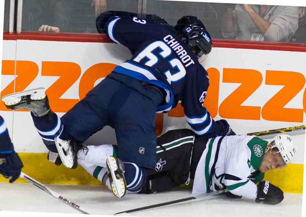 DAVID LIPNOWSKI / WINNIPEG FREE PRESS
Dallas Stars Ales Hemsky (#83) is taken down by Winnipeg Jets Ben Chiarot (#63) during first period.