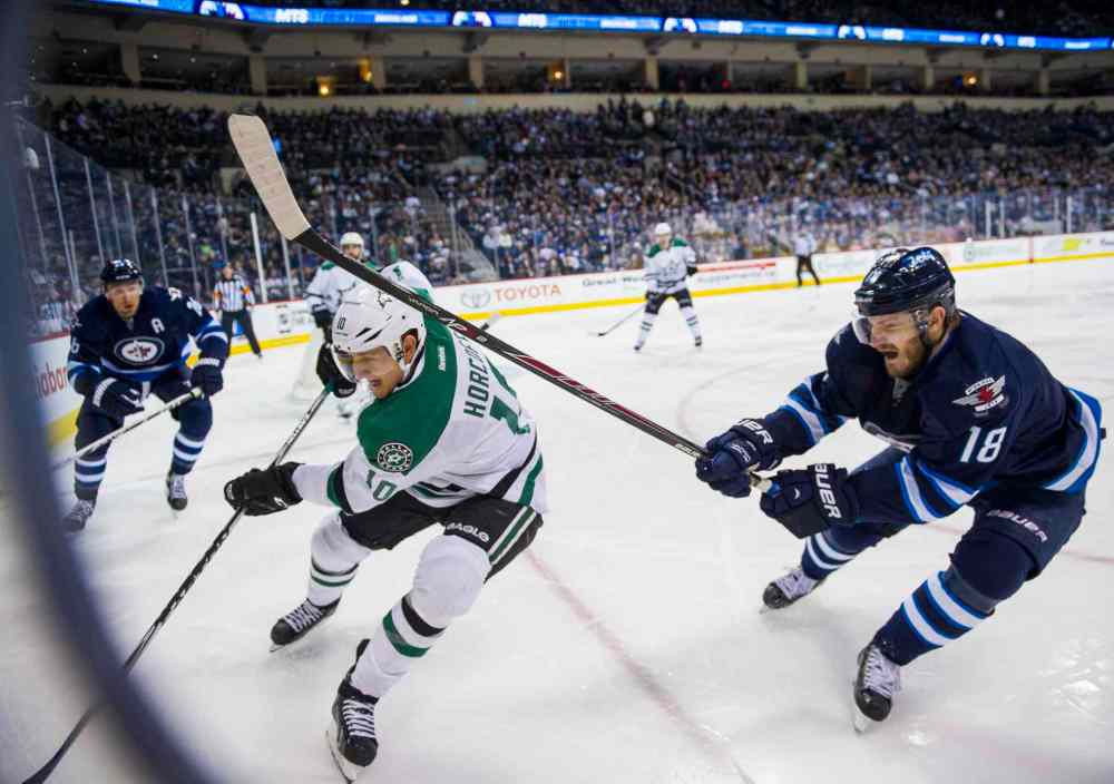 David Lipnowski / Winnipeg Free Press
Winnipeg Jets Bryan Little (#18) collides with Dallas Stars Shawn Horcoff (#10) during second period.