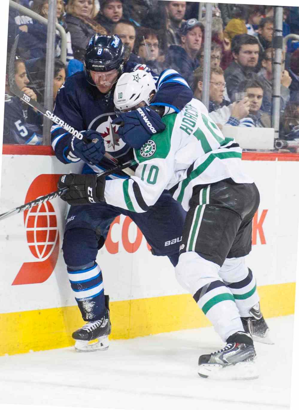 DAVID LIPNOWSKI / WINNIPEG FREE PRESS
Winnipeg Jets Jacob Trouba (#8) grapples with Dallas Stars Shawn Horcoff (#10) during the third period of Saturday's game.