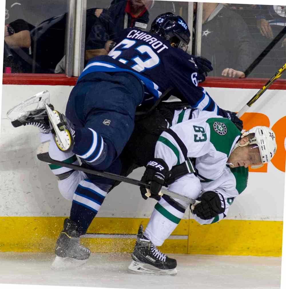 DAVID LIPNOWSKI / WINNIPEG FREE PRESS
Dallas Stars Ales Hemsky (#83) is taken down by Winnipeg Jets Ben Chiarot (#63) during first period.
