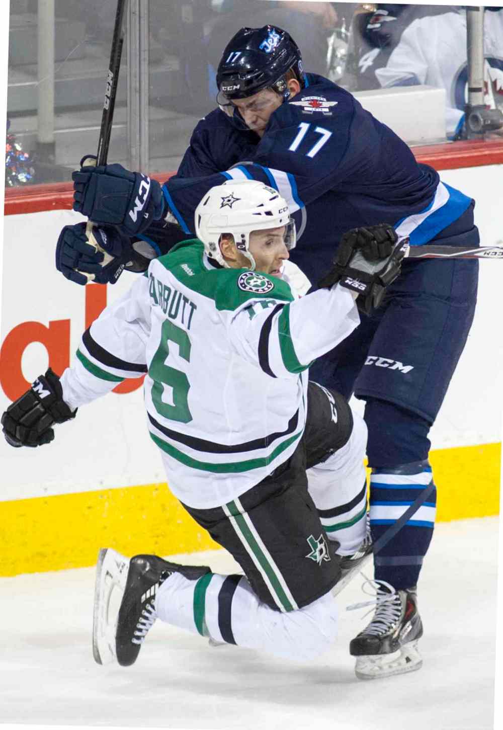 DAVID LIPNOWSKI / WINNIPEG FREE PRESS
Dallas Stars Trevor Daley (#6) is taken down by Winnipeg Jets Adam Lowry(#17) during first period.