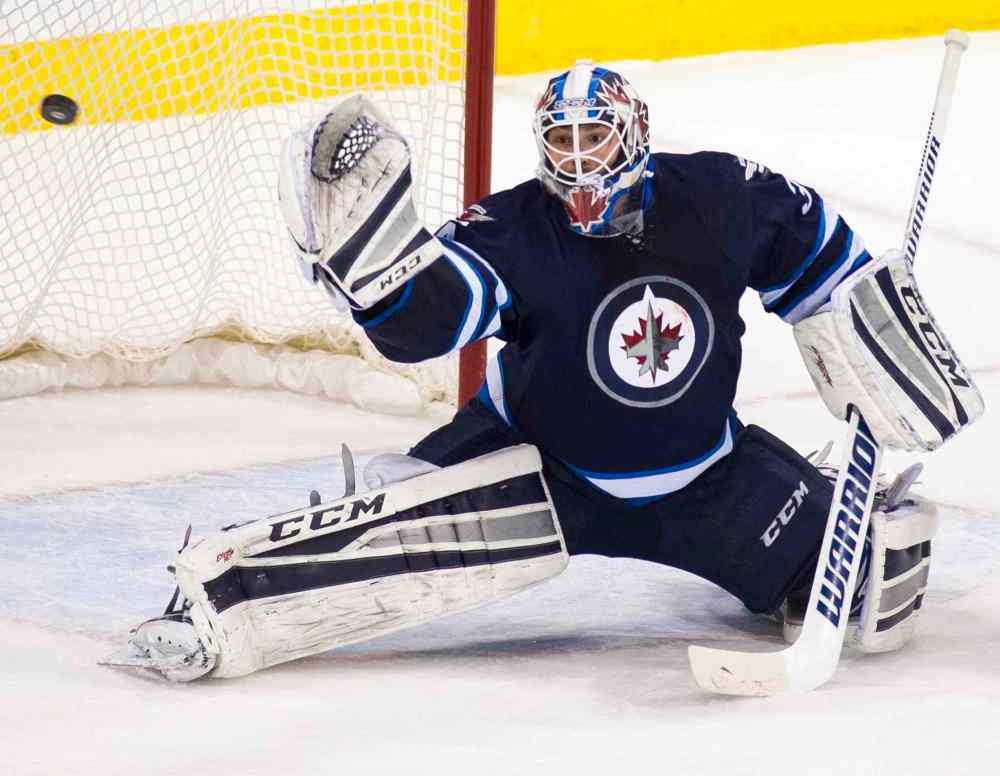 DAVID LIPNOWSKI / WINNIPEG FREE PRESS
Winnipeg Jets goaltender Michael Hutchinson (#34) blocks a Dallas Stars' shot during first period at the MTS Centre Saturday.