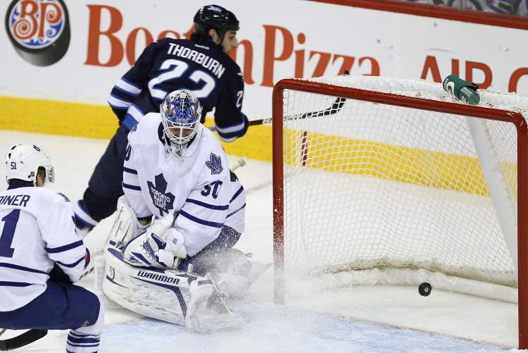 John Woods / Winnipeg Free Press
Winnipeg Jets Chris Thorburn scores on Toronto Maple Leafs' goaltender Jonas Gustavsson during first-period action Tuesday at the MTS Centre.